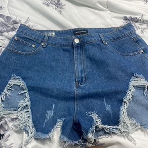 extreme thigh rip shorts.